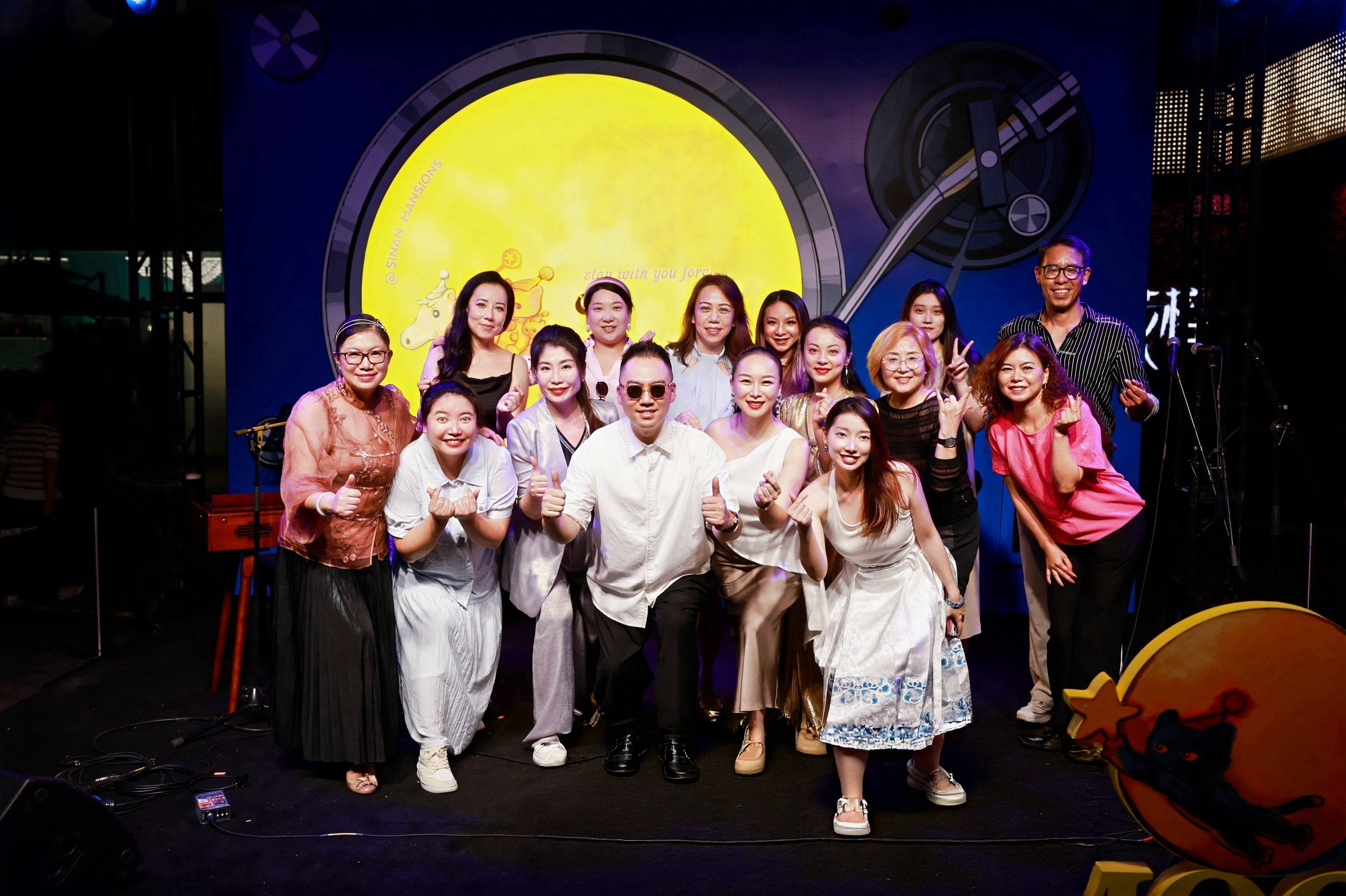 Jasmine Chen performing with student singers